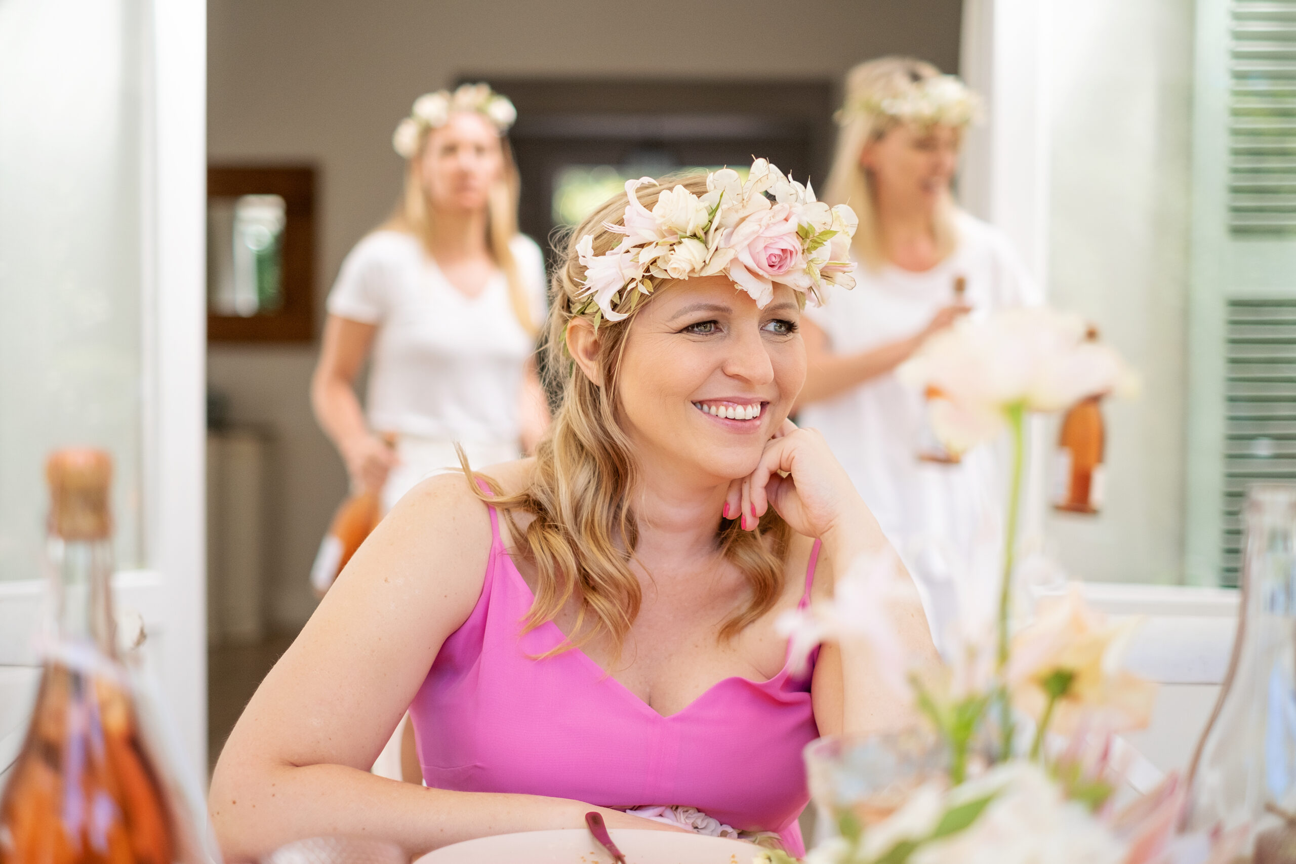 Pregnant woman wearing a pink flower garland